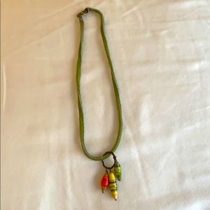 Green leather necklace with tribal charms